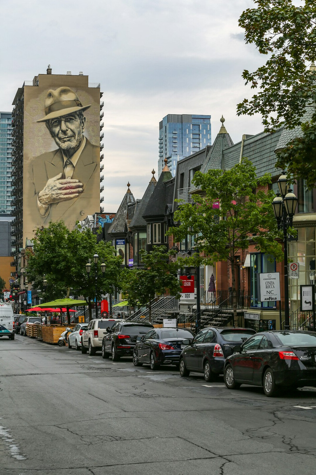 Colorful mural covering an alley wall in a Montreal neighborhood
