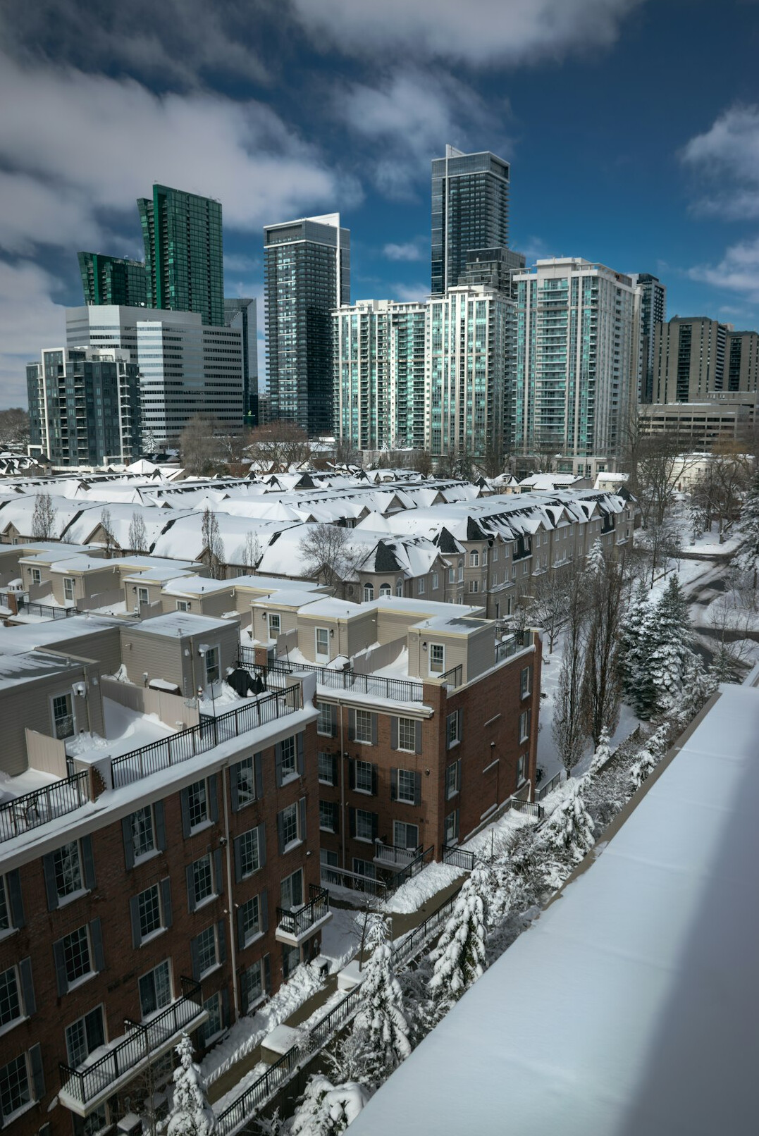 Snow covered laneway between houses in a Canadian winter neighborhood